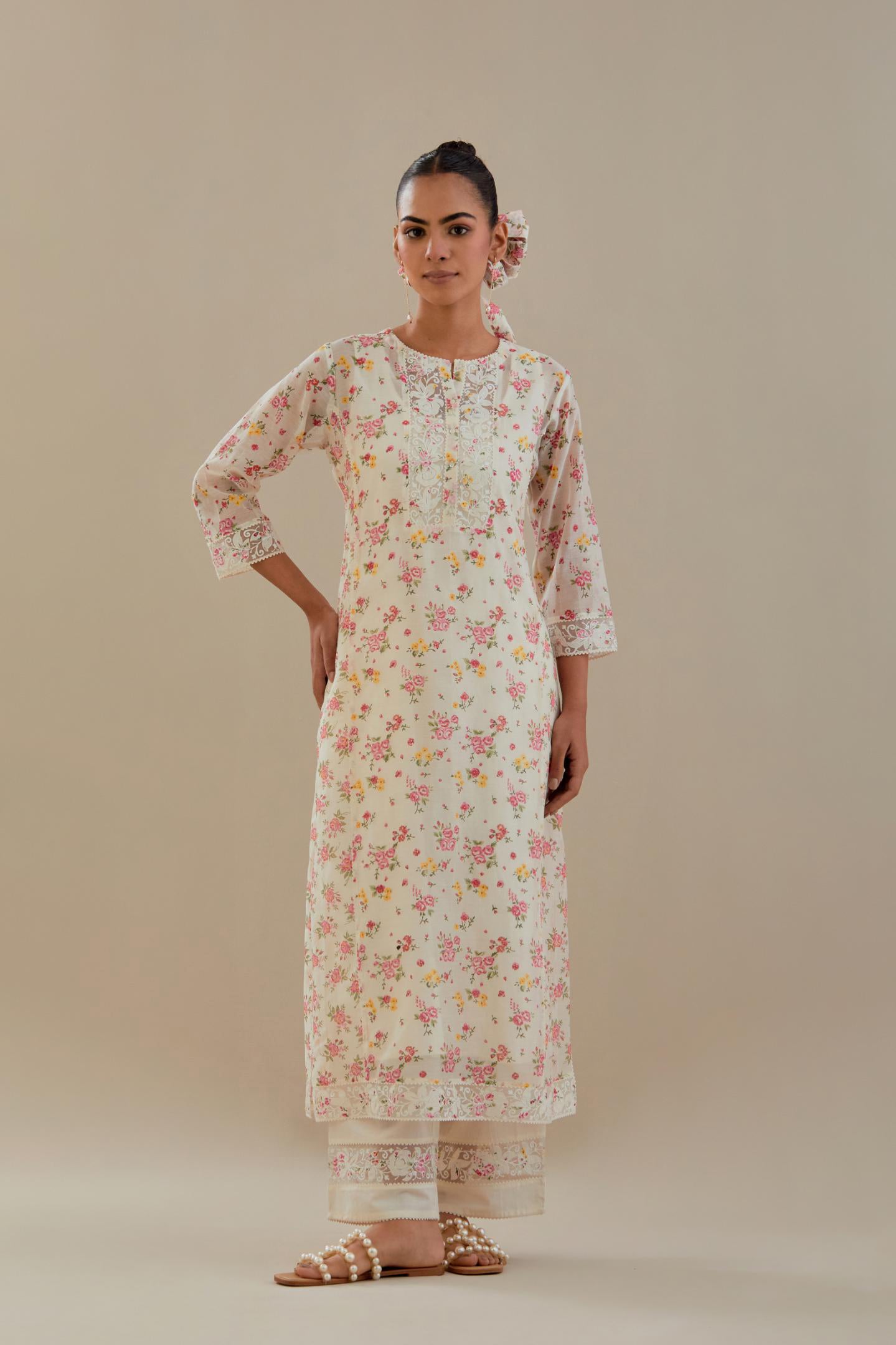 Off white cotton chanderi kurta set with small floral hand block print, highlighted with applique embroidery and ricrac lace.