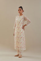Off white cotton chanderi kurta set with small floral hand block print, highlighted with applique embroidery and ricrac lace.