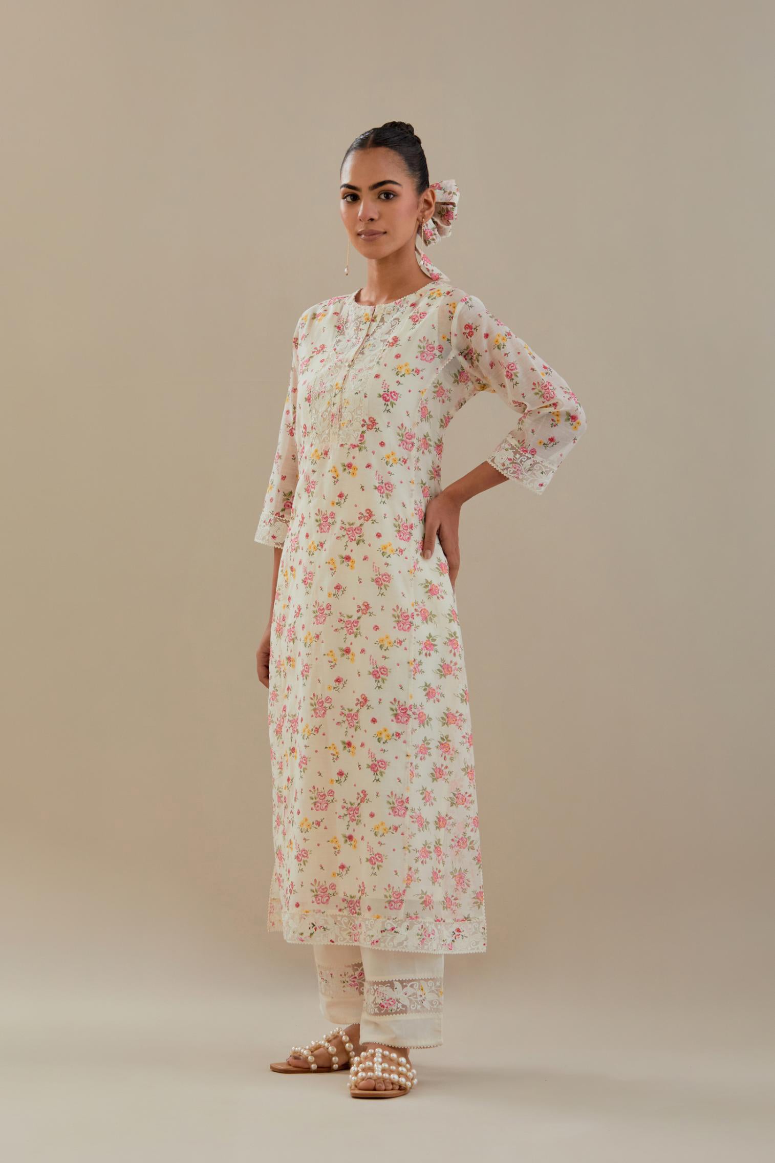 Off white cotton chanderi kurta set with small floral hand block print, highlighted with applique embroidery and ricrac lace.
