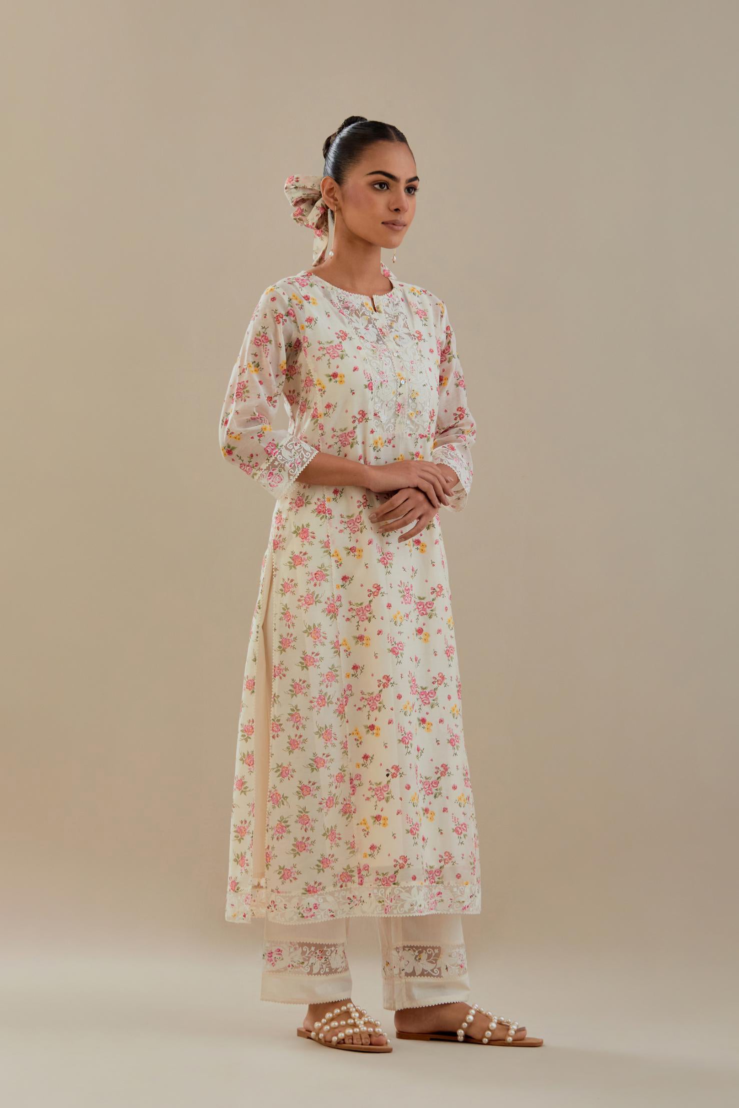 Off white cotton chanderi kurta set with small floral hand block print, highlighted with applique embroidery and ricrac lace.