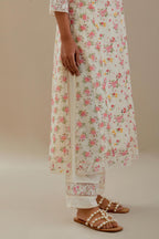 Off white cotton chanderi kurta set with small floral hand block print, highlighted with applique embroidery and ricrac lace.