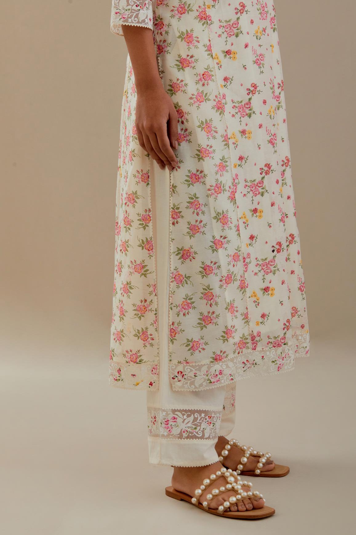 Off white cotton chanderi kurta set with small floral hand block print, highlighted with applique embroidery and ricrac lace.
