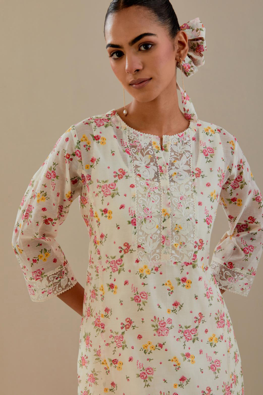 Off white cotton chanderi kurta set with small floral hand block print, highlighted with applique embroidery and ricrac lace.