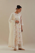 Off white cotton chanderi kurta set with small floral hand block print, highlighted with applique embroidery and ricrac lace.