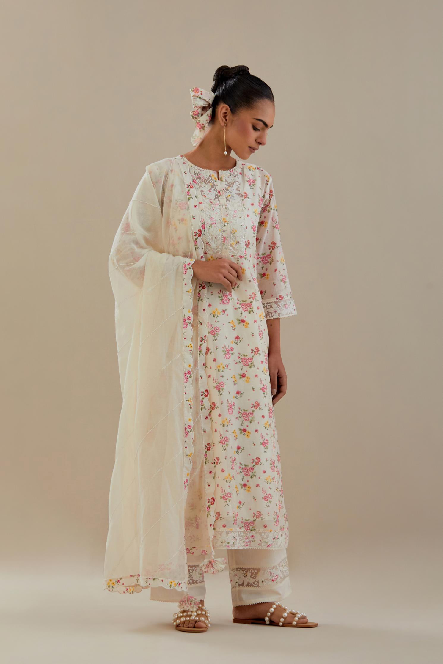 Off white cotton chanderi kurta set with small floral hand block print, highlighted with applique embroidery and ricrac lace.