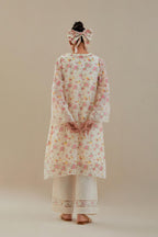 Off white cotton chanderi A-line short kurta set with small floral hand block print, highlighted with applique embroidery and ricrac lace.