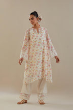 Off white cotton chanderi A-line short kurta set with small floral hand block print, highlighted with applique embroidery and ricrac lace.