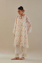 Off white cotton chanderi A-line short kurta set with small floral hand block print, highlighted with applique embroidery and ricrac lace.