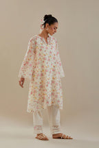 Off white cotton chanderi A-line short kurta set with small floral hand block print, highlighted with applique embroidery and ricrac lace.
