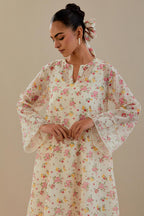 Off white cotton chanderi A-line short kurta set with small floral hand block print, highlighted with applique embroidery and ricrac lace.