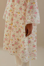 Off white cotton chanderi A-line short kurta set with small floral hand block print, highlighted with applique embroidery and ricrac lace.