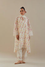 Off white cotton chanderi A-line short kurta set with small floral hand block print, highlighted with applique embroidery and ricrac lace.