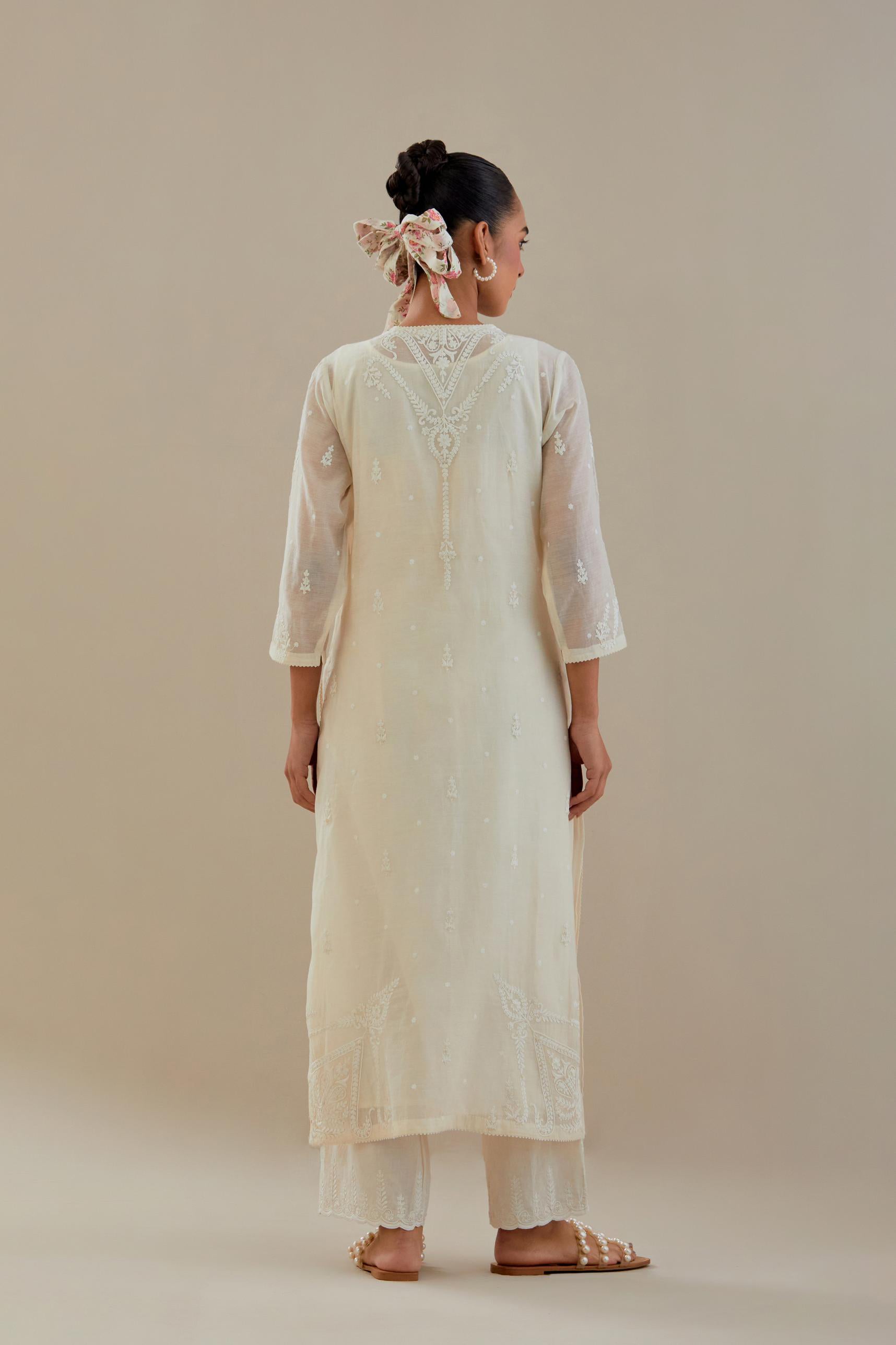 Off white cotton chanderi straight kurta set, highlighted with off white dori embroidery.