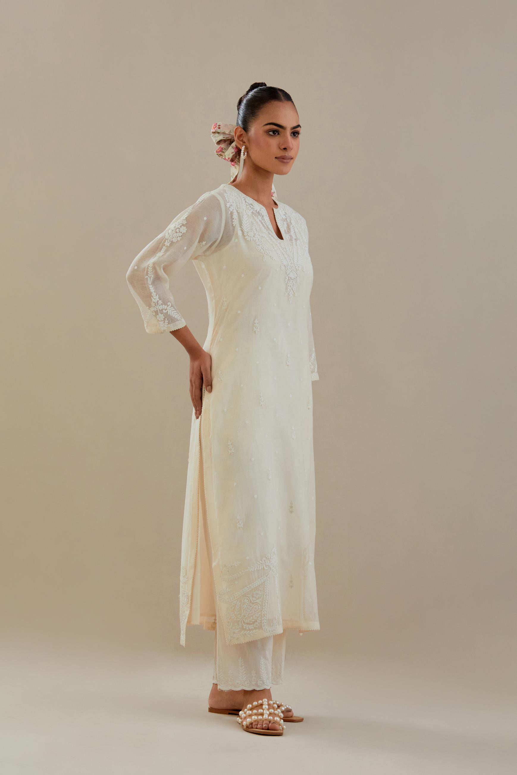 Off white cotton chanderi straight kurta set, highlighted with off white dori embroidery.