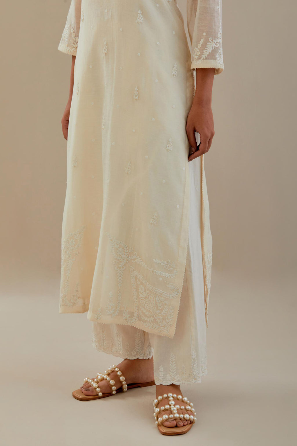 Off white cotton chanderi straight kurta set, highlighted with off white dori embroidery.