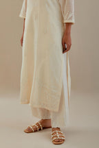 Off white cotton chanderi straight kurta set, highlighted with off white dori embroidery.