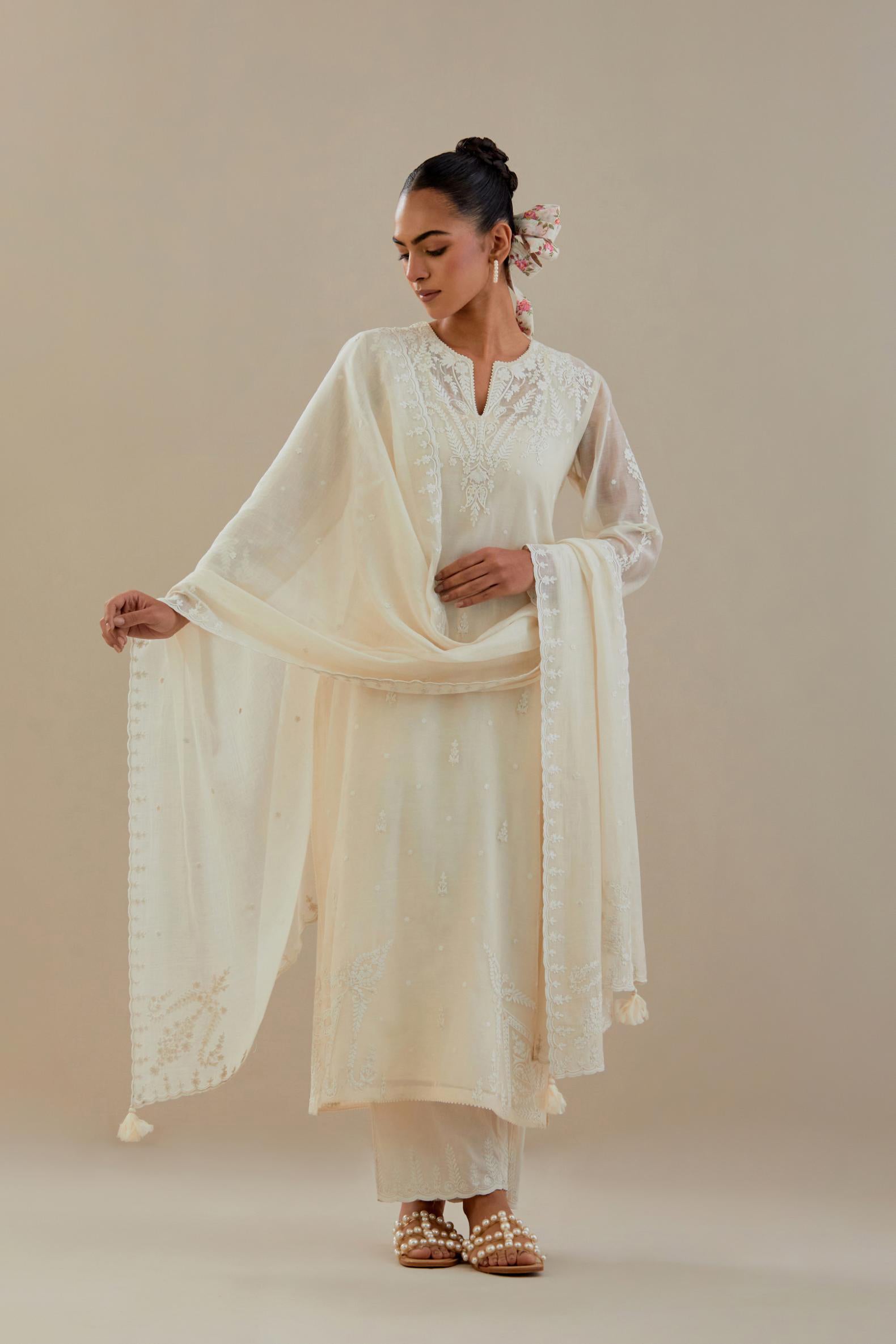 Off white cotton chanderi dupatta with all-over thread & edges are finished with dori embroidery, highlighted with sequins work.