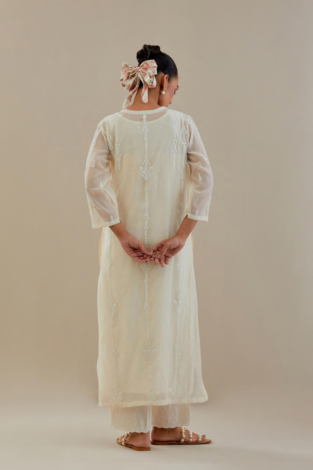 Off white cotton chanderi straight kurta set with off white dori embroidery, highlighted with sequins work.