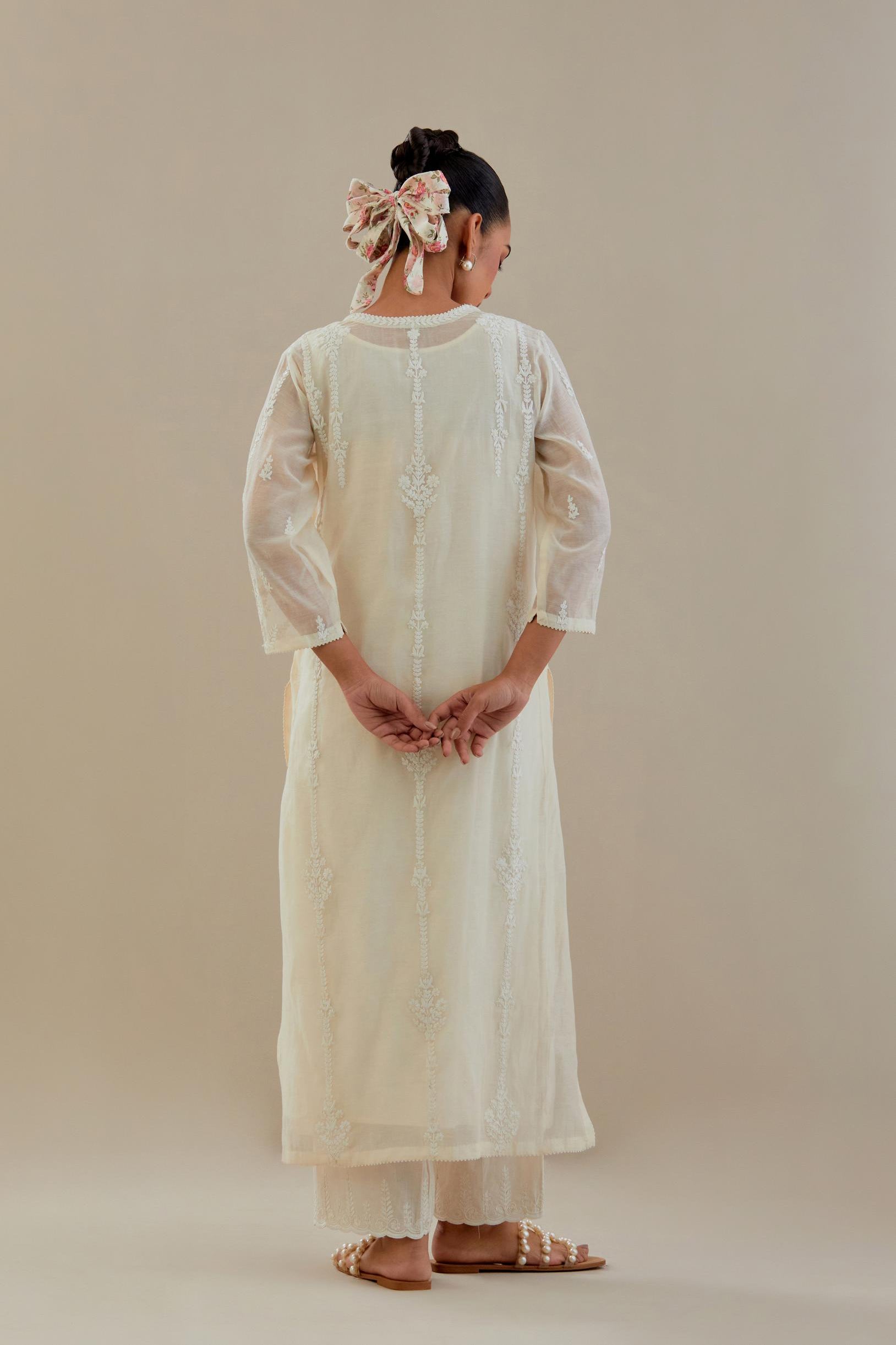 Off white cotton chanderi straight kurta set with off white dori embroidery, highlighted with sequins work.