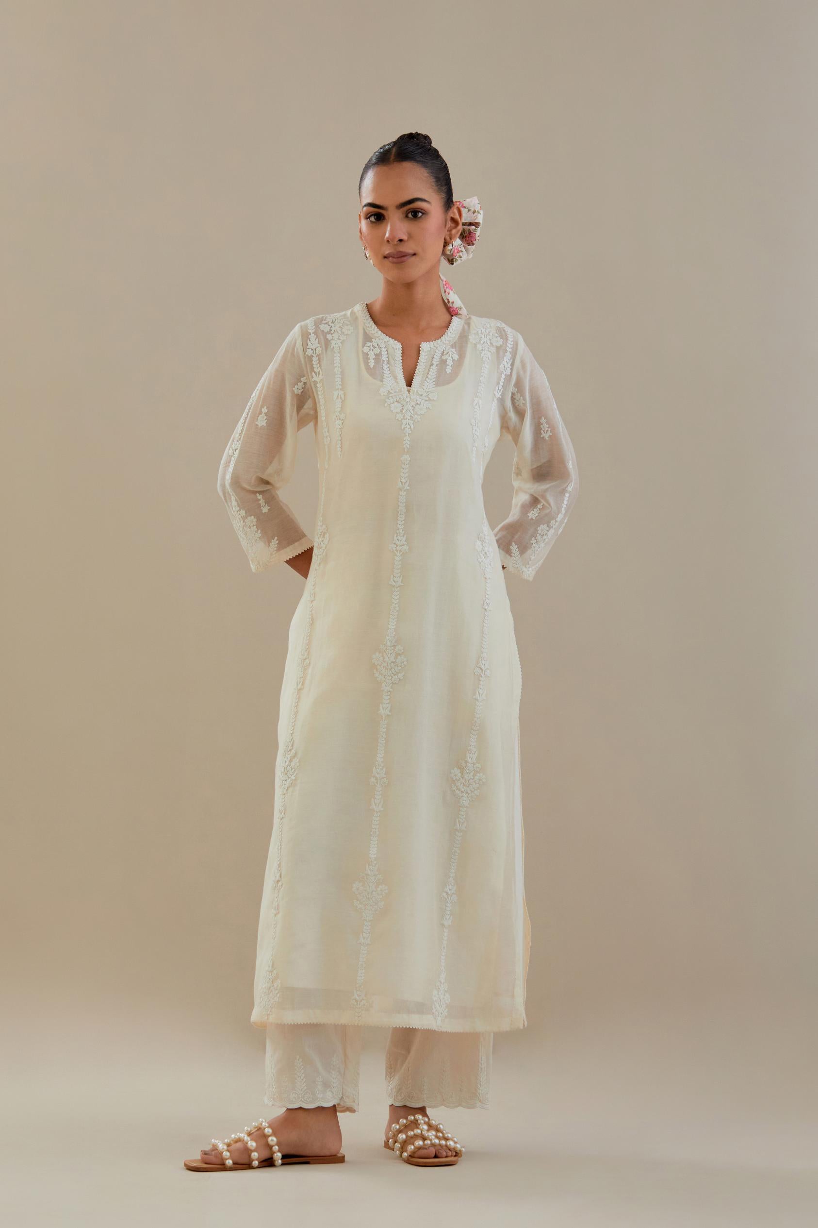 Off white cotton chanderi straight kurta set with off white dori embroidery, highlighted with sequins work.