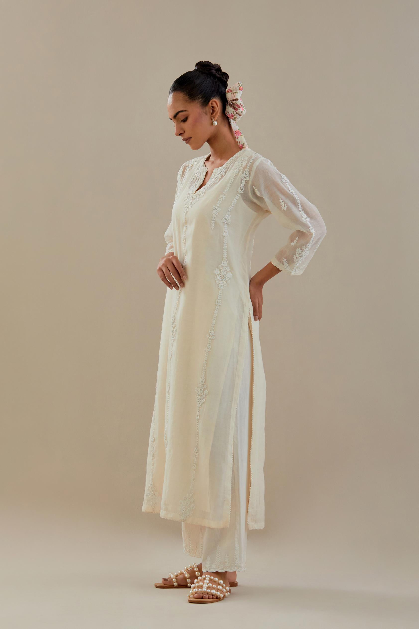 Off white cotton chanderi straight kurta set with off white dori embroidery, highlighted with sequins work.