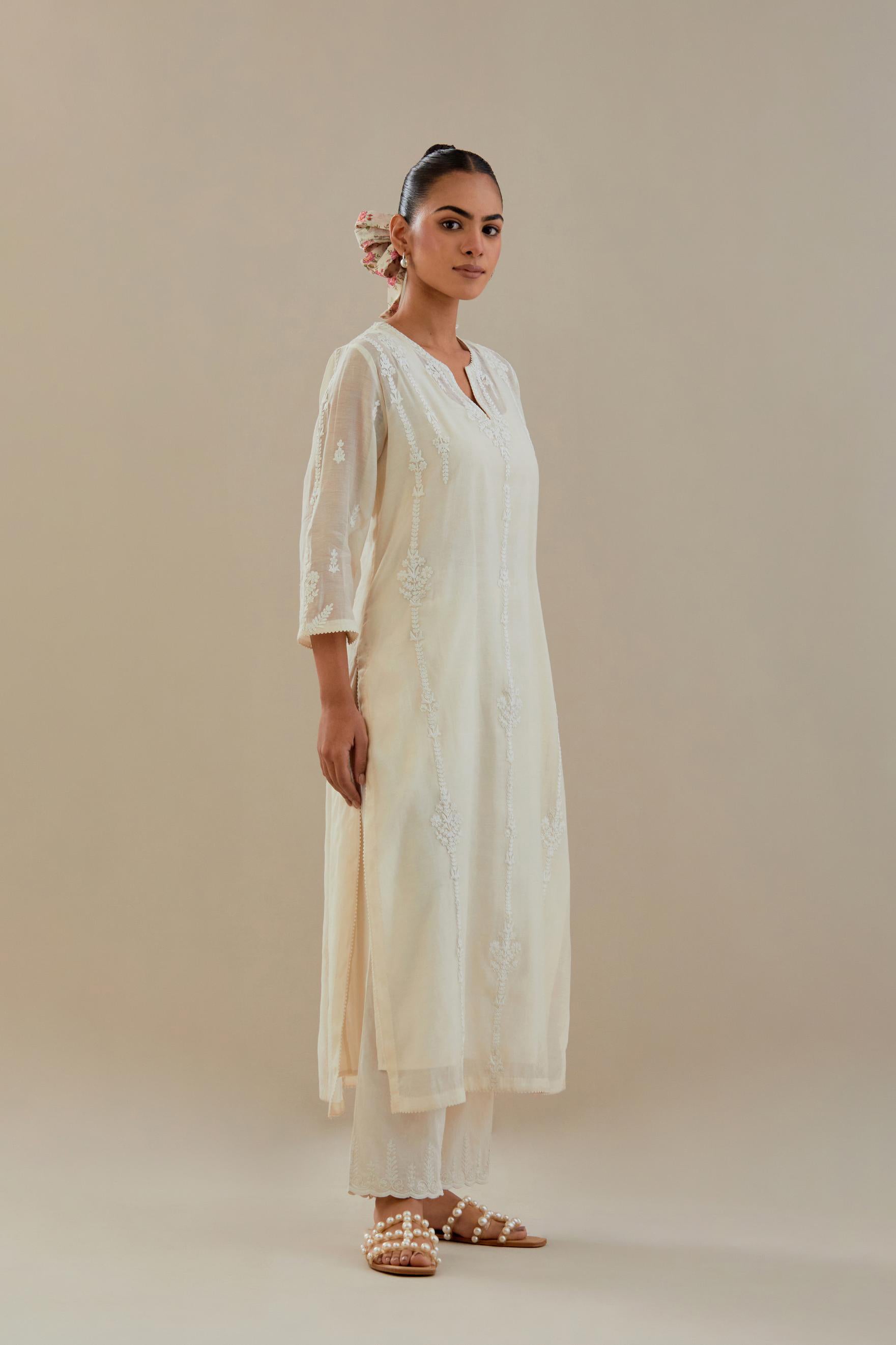 Off white cotton chanderi straight kurta set with off white dori embroidery, highlighted with sequins work.