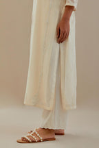 Off white cotton chanderi straight kurta set with off white dori embroidery, highlighted with sequins work.