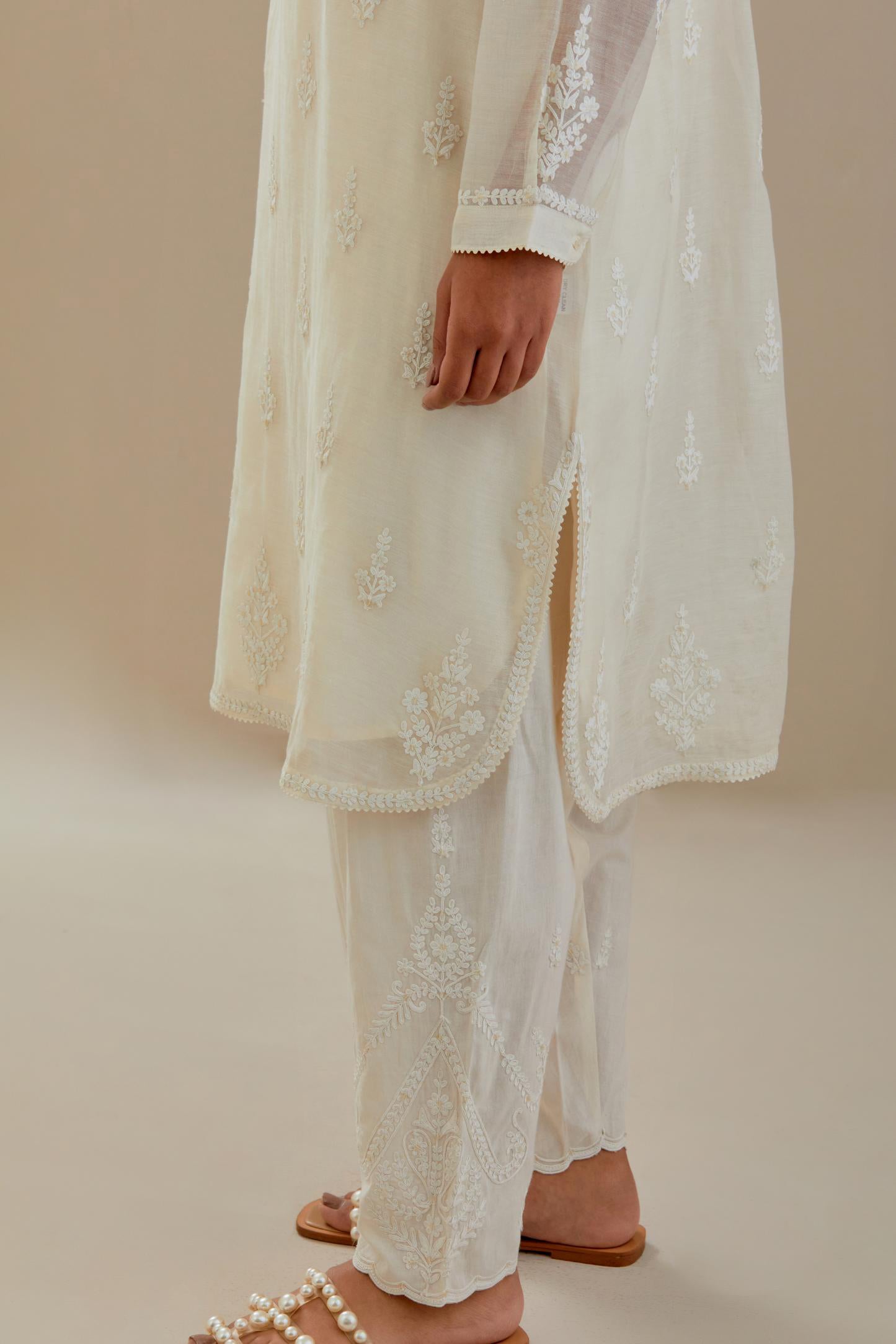 Off white cotton chanderi straight short kurta set with all-over off white dori embroidery.