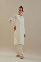 Off white cotton chanderi straight short kurta set with all-over off white dori embroidery.