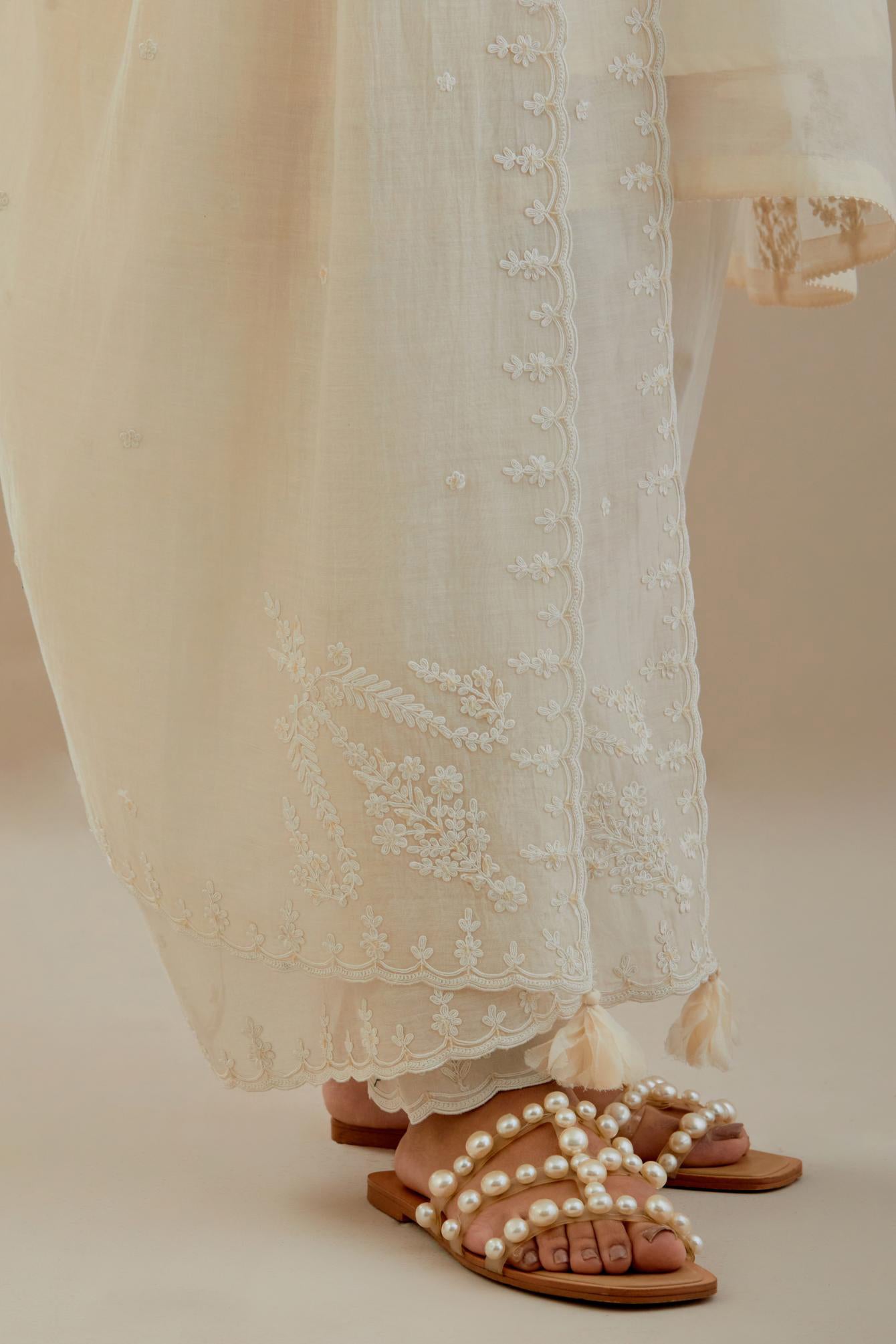 Off white cotton chanderi dupatta with all-over thread & edges are finished with dori embroidery, highlighted with sequins work.
