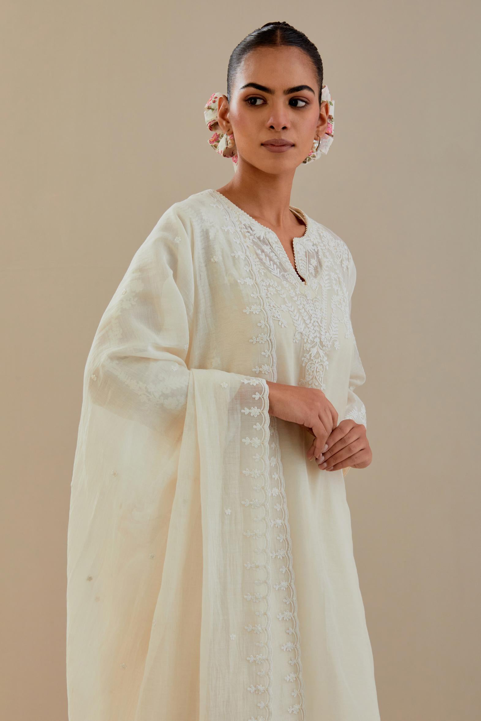 Off white cotton chanderi dupatta with all-over thread & edges are finished with dori embroidery, highlighted with sequins work.