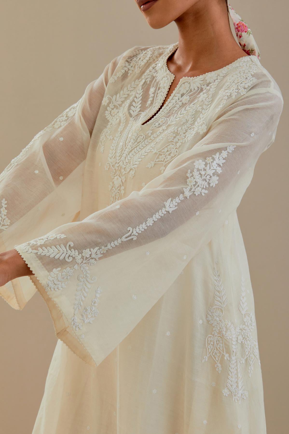 Off white cotton chanderi A-line kurta set highlighted with off white dori embroidery.