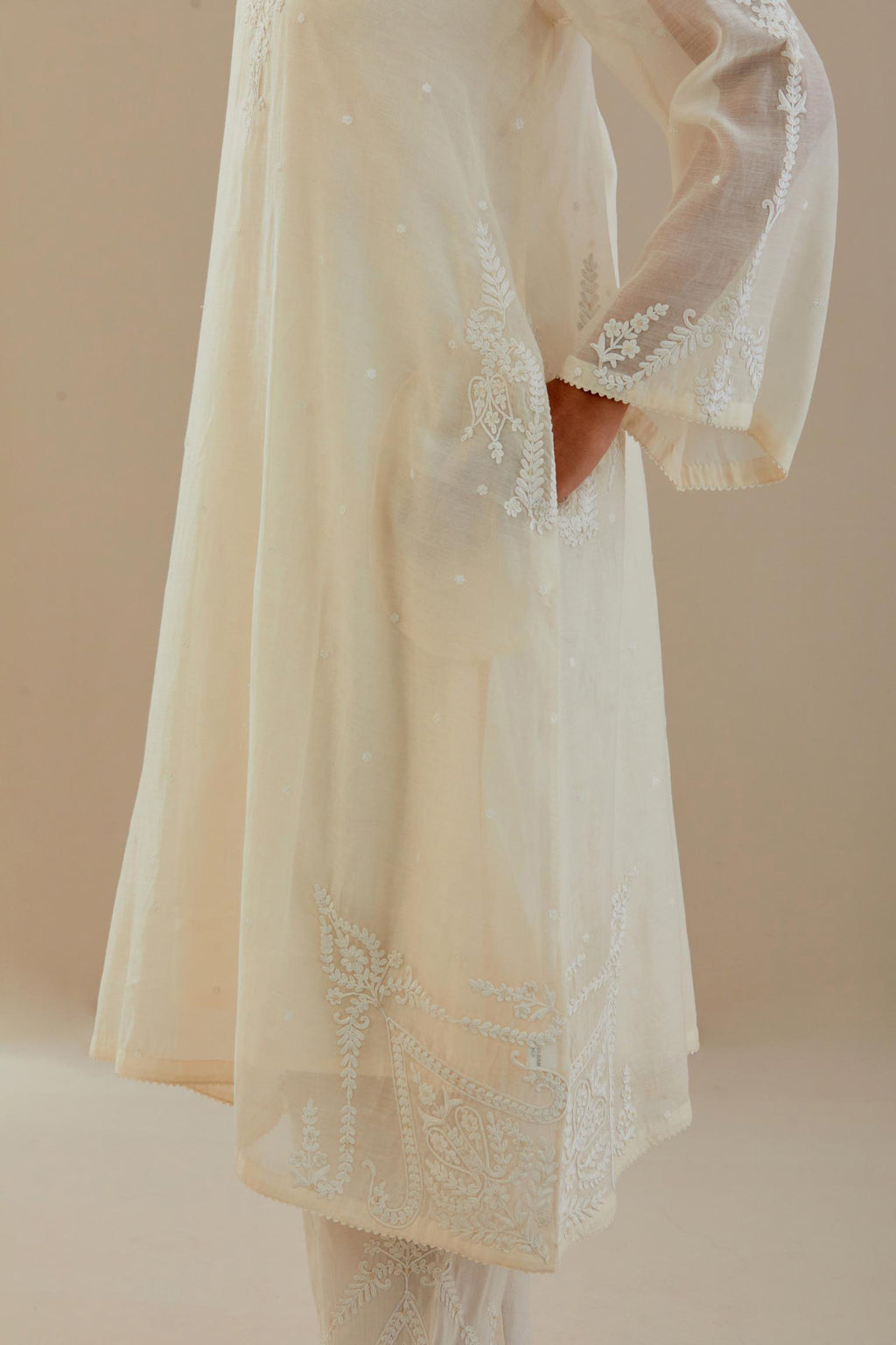 Off white cotton chanderi A-line kurta set highlighted with off white dori embroidery.