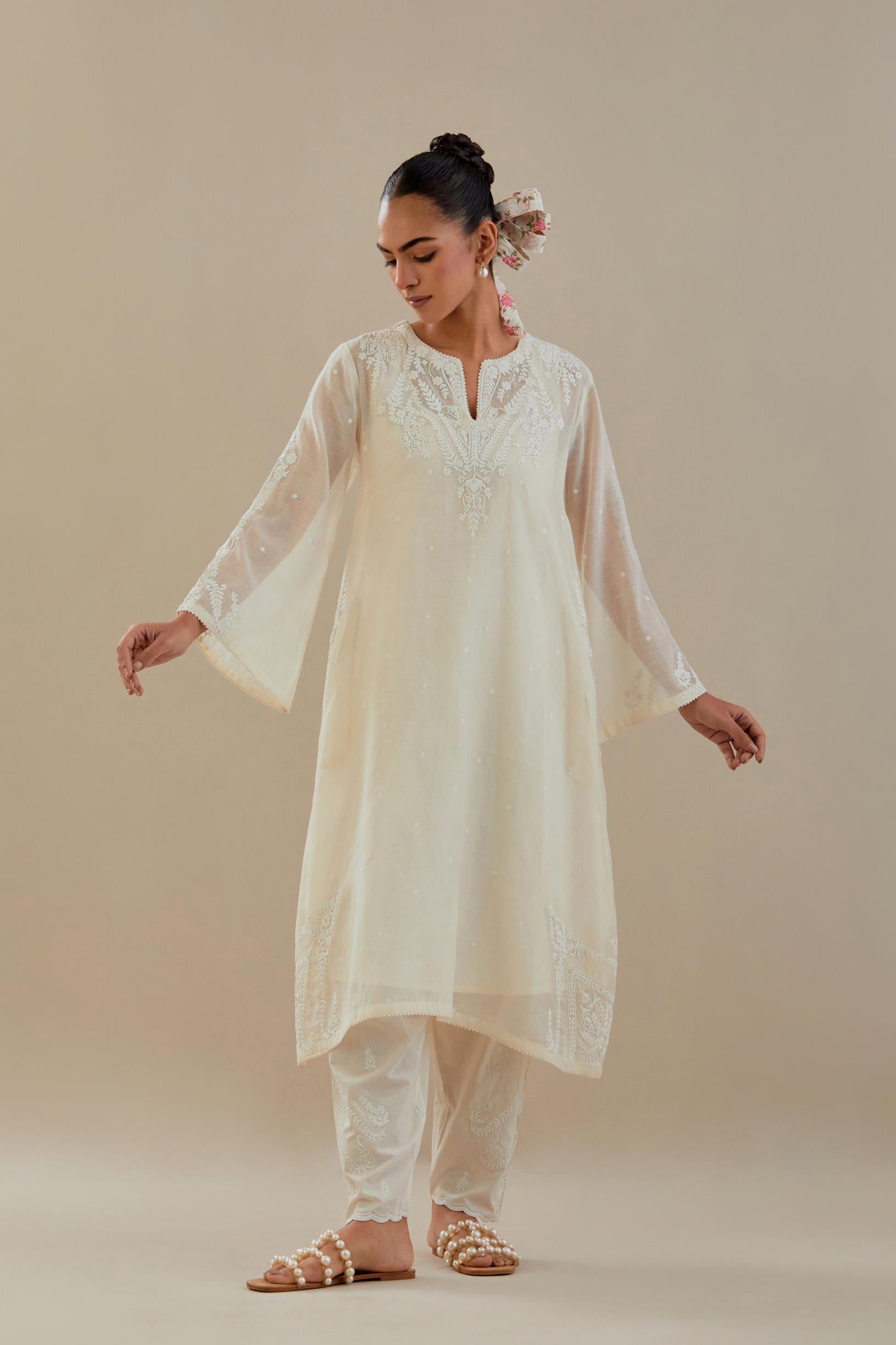 Off white cotton chanderi A-line kurta set highlighted with off white dori embroidery.