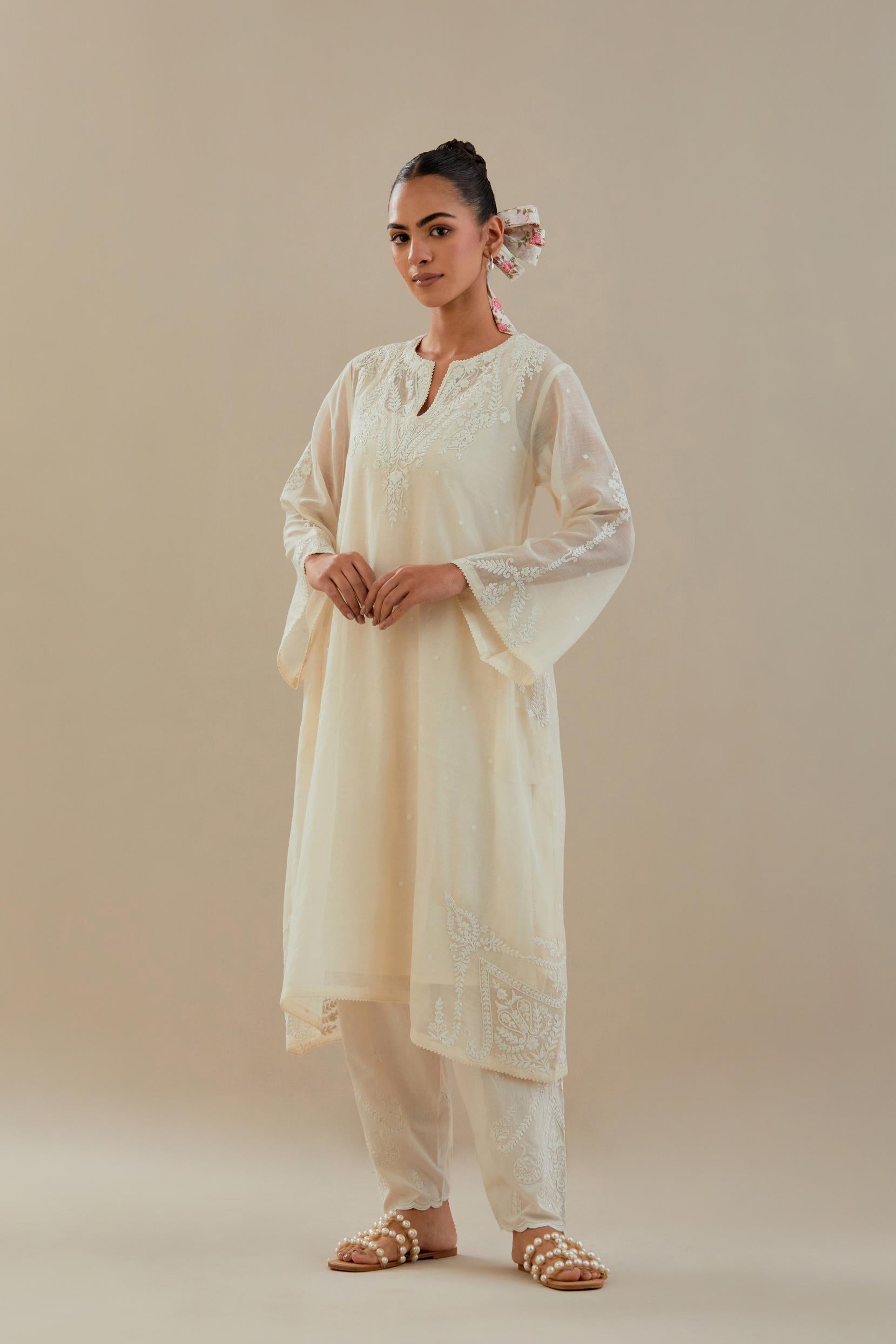 Off white cotton chanderi A-line kurta set highlighted with off white dori embroidery.
