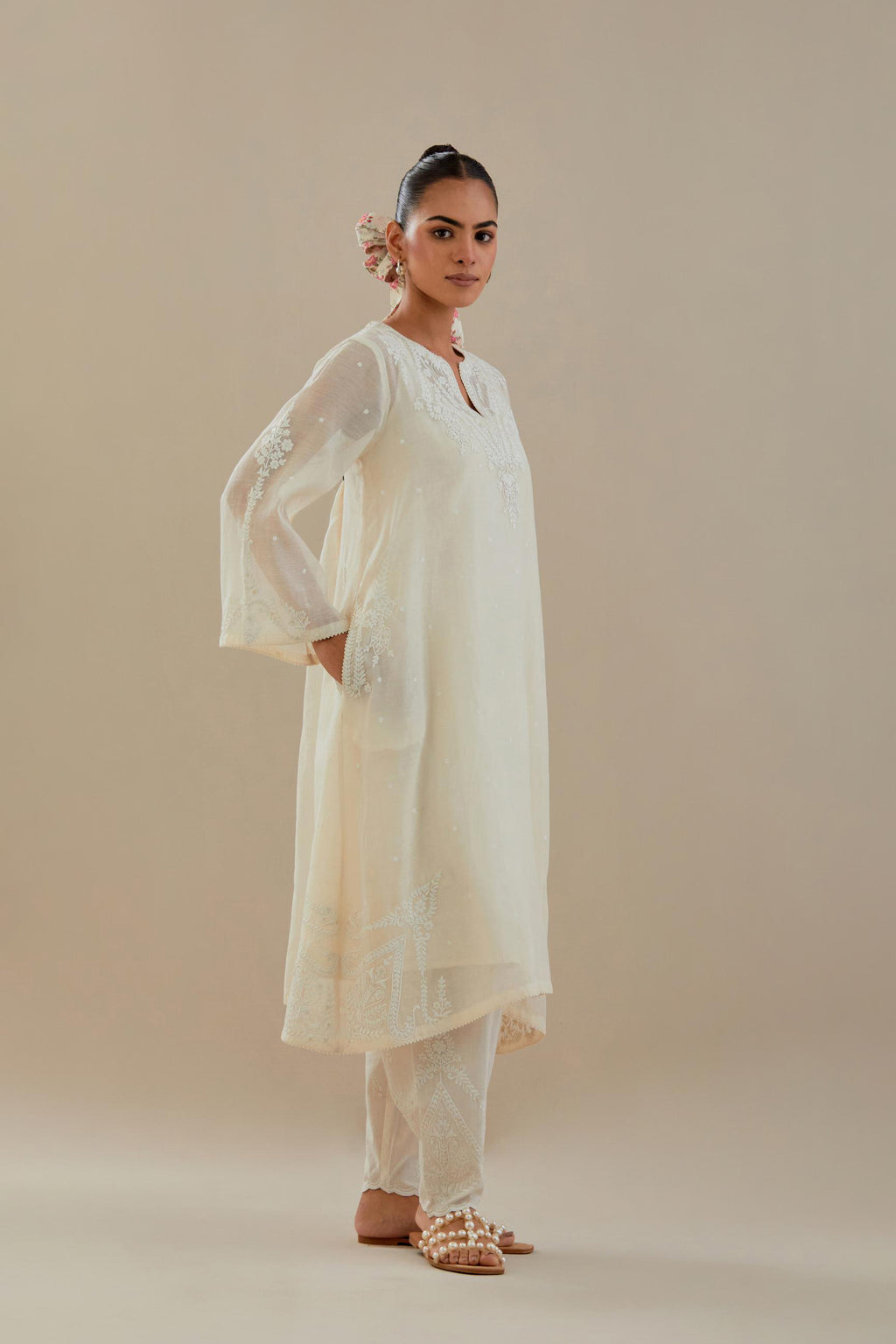 Off white cotton chanderi A-line kurta set highlighted with off white dori embroidery.