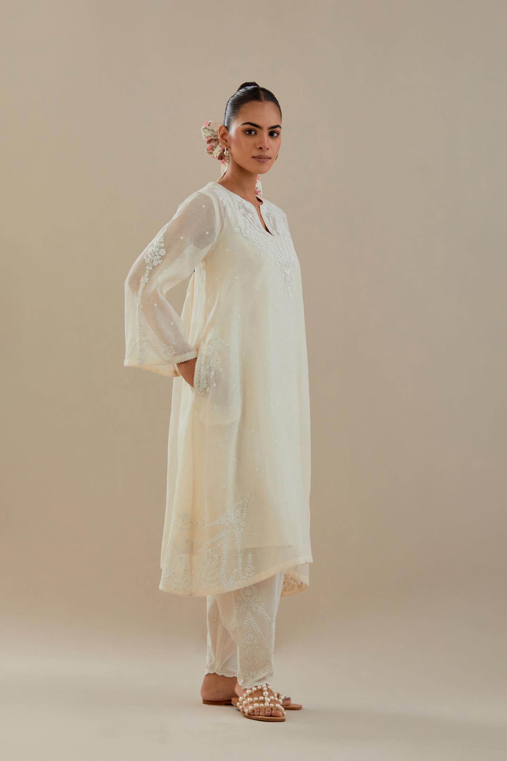 Off white cotton chanderi A-line kurta set highlighted with off white dori embroidery.