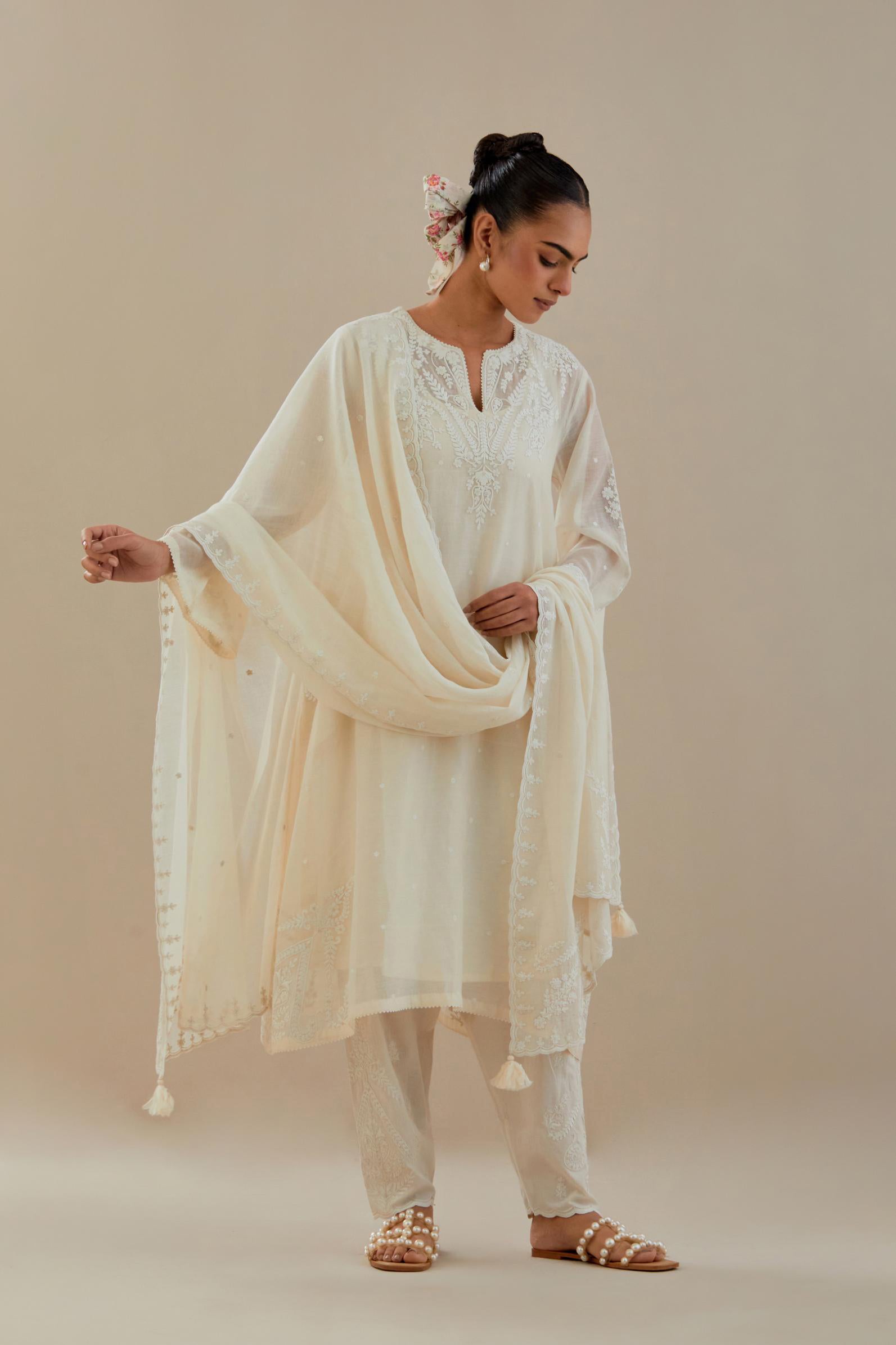 Off white cotton chanderi dupatta with all-over thread & edges are finished with dori embroidery, highlighted with sequins work.