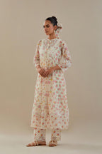 Off white cotton chanderi Kurta set dress with all-over small multi colored hand block print, highlighted with applique embroidery and ricrac lace.