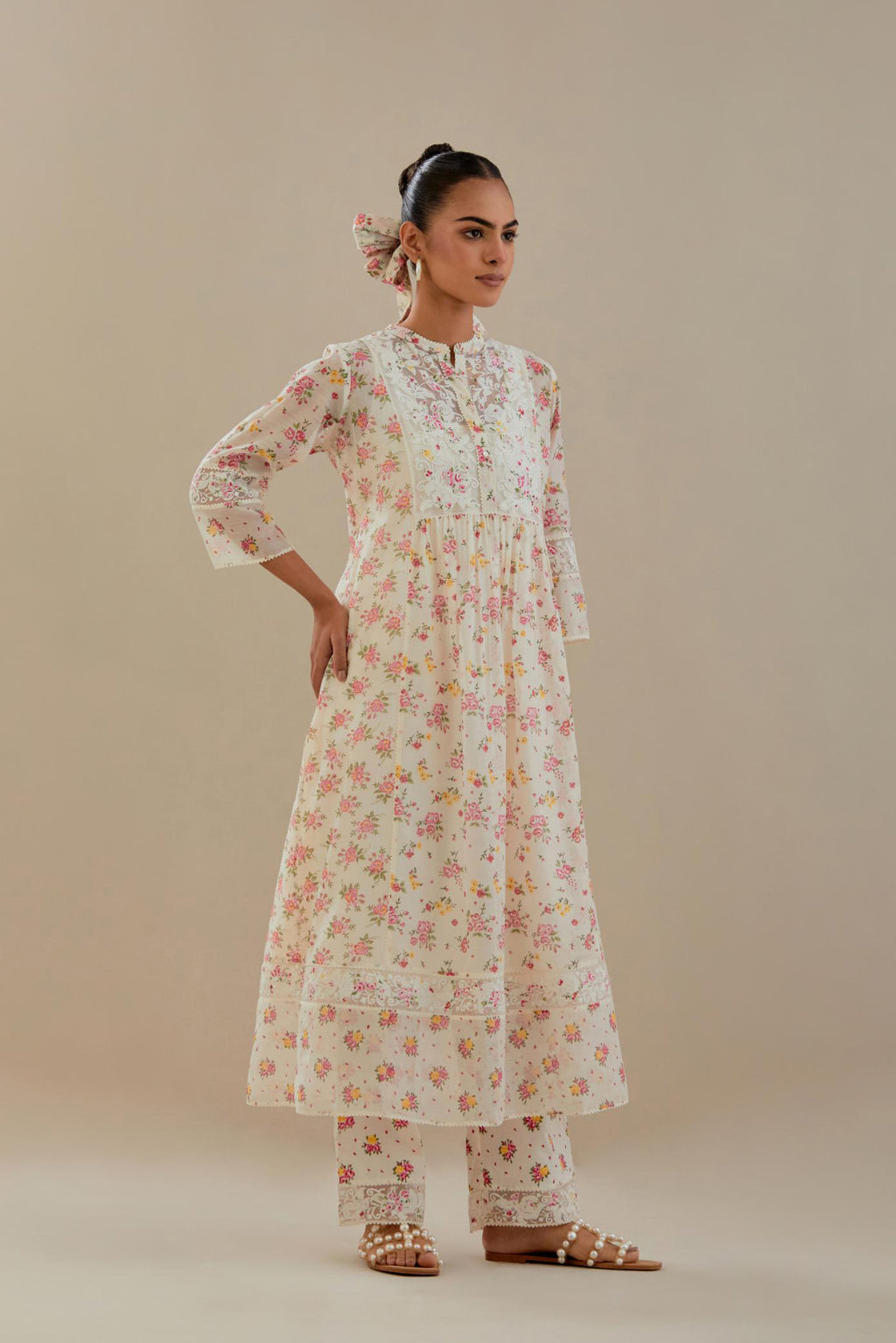 Off white cotton chanderi Kurta set dress with all-over small multi colored hand block print, highlighted with applique embroidery and ricrac lace.