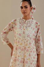 Off white cotton chanderi Kurta set dress with all-over small multi colored hand block print, highlighted with applique embroidery and ricrac lace.
