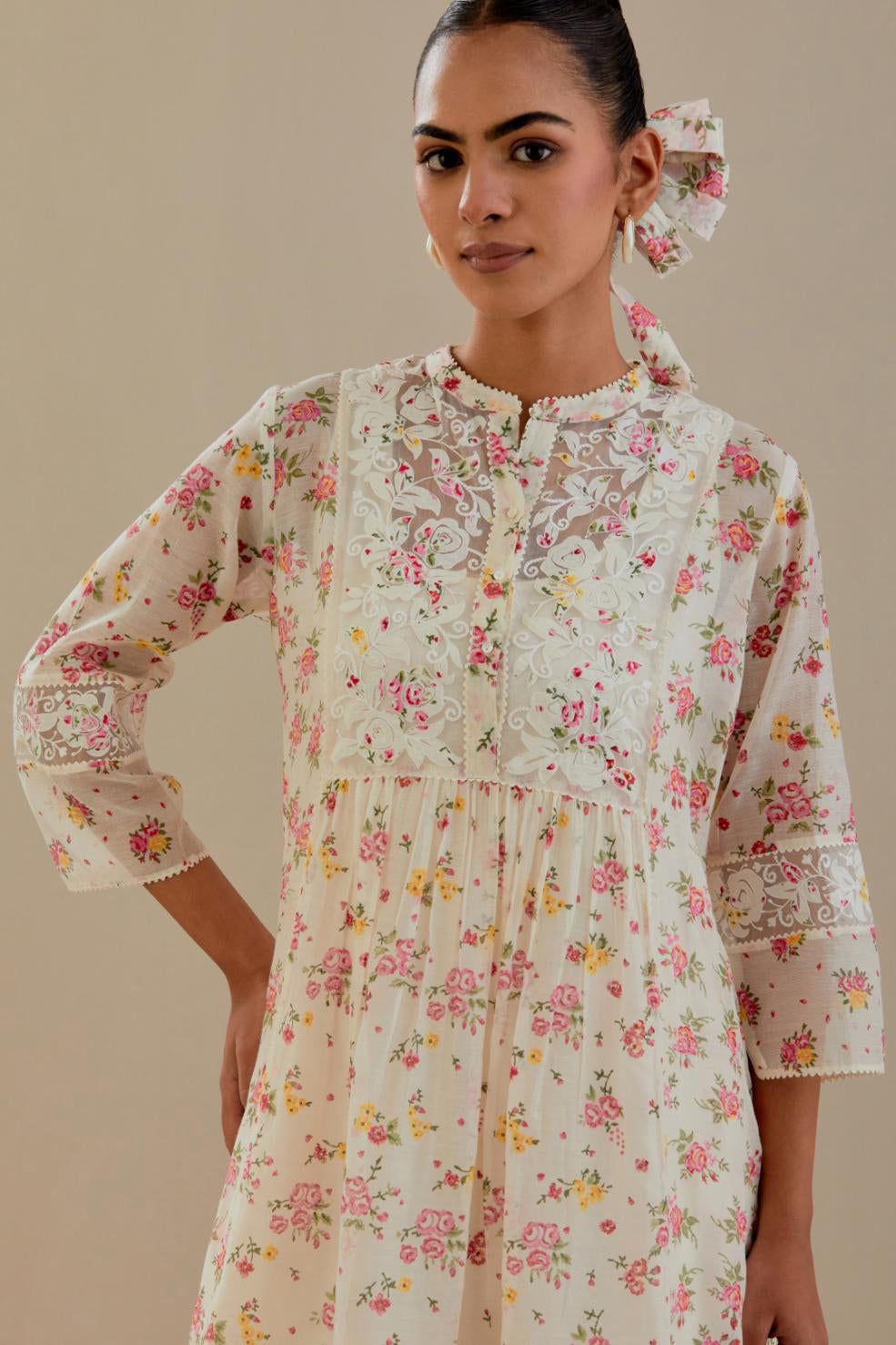 Off white cotton chanderi Kurta set dress with all-over small multi colored hand block print, highlighted with applique embroidery and ricrac lace.