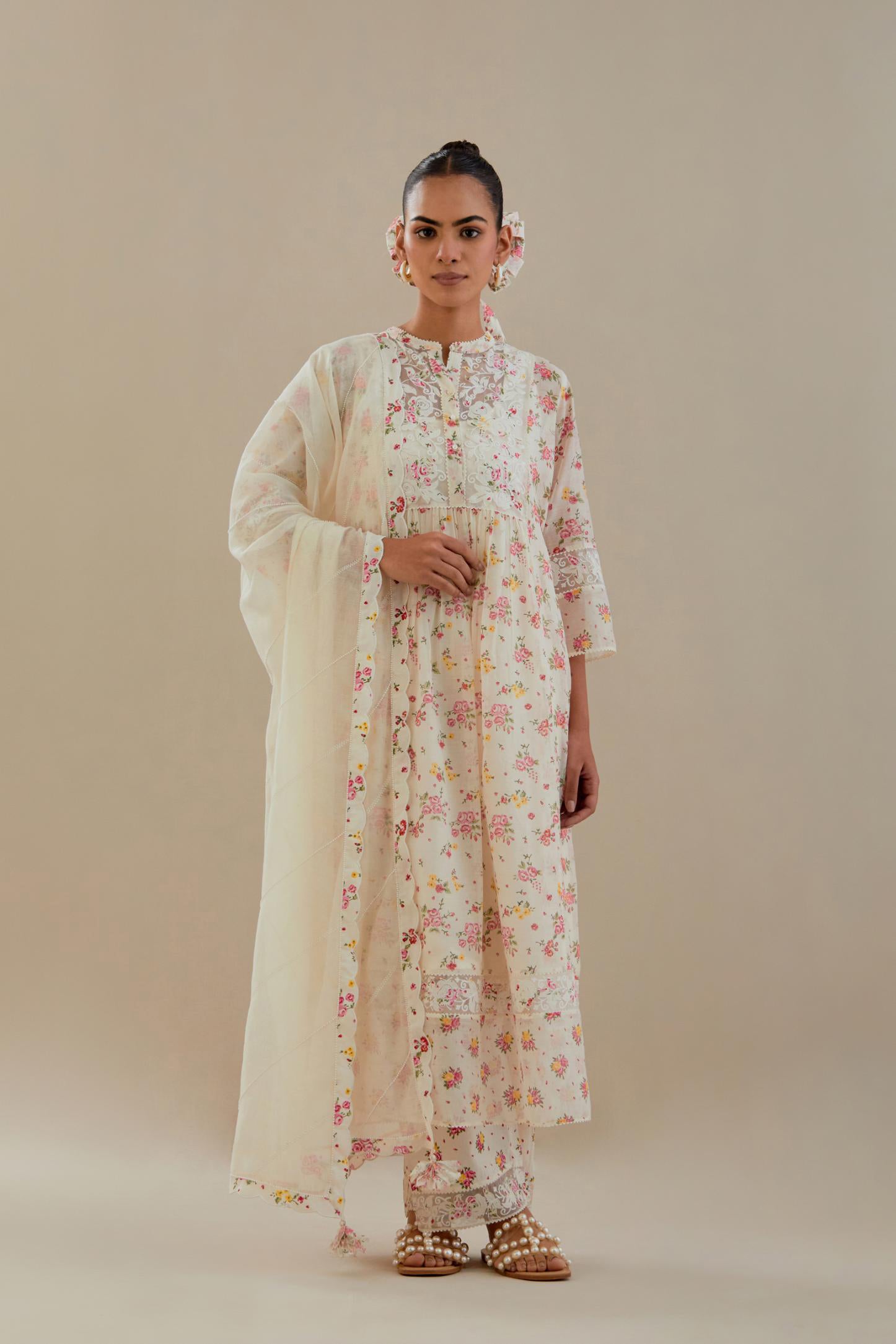 Off white cotton chanderi Kurta set dress with all-over small multi colored hand block print, highlighted with applique embroidery and ricrac lace.