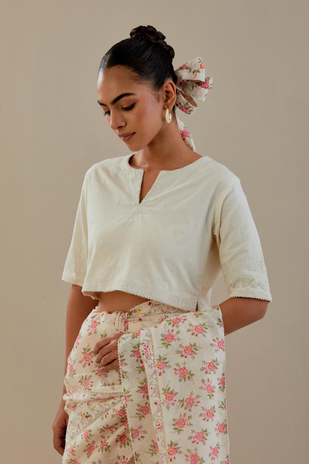 Off-white cotton blouse with thread embroidery & bead work.