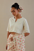 Off-white cotton blouse with thread embroidery & bead work.