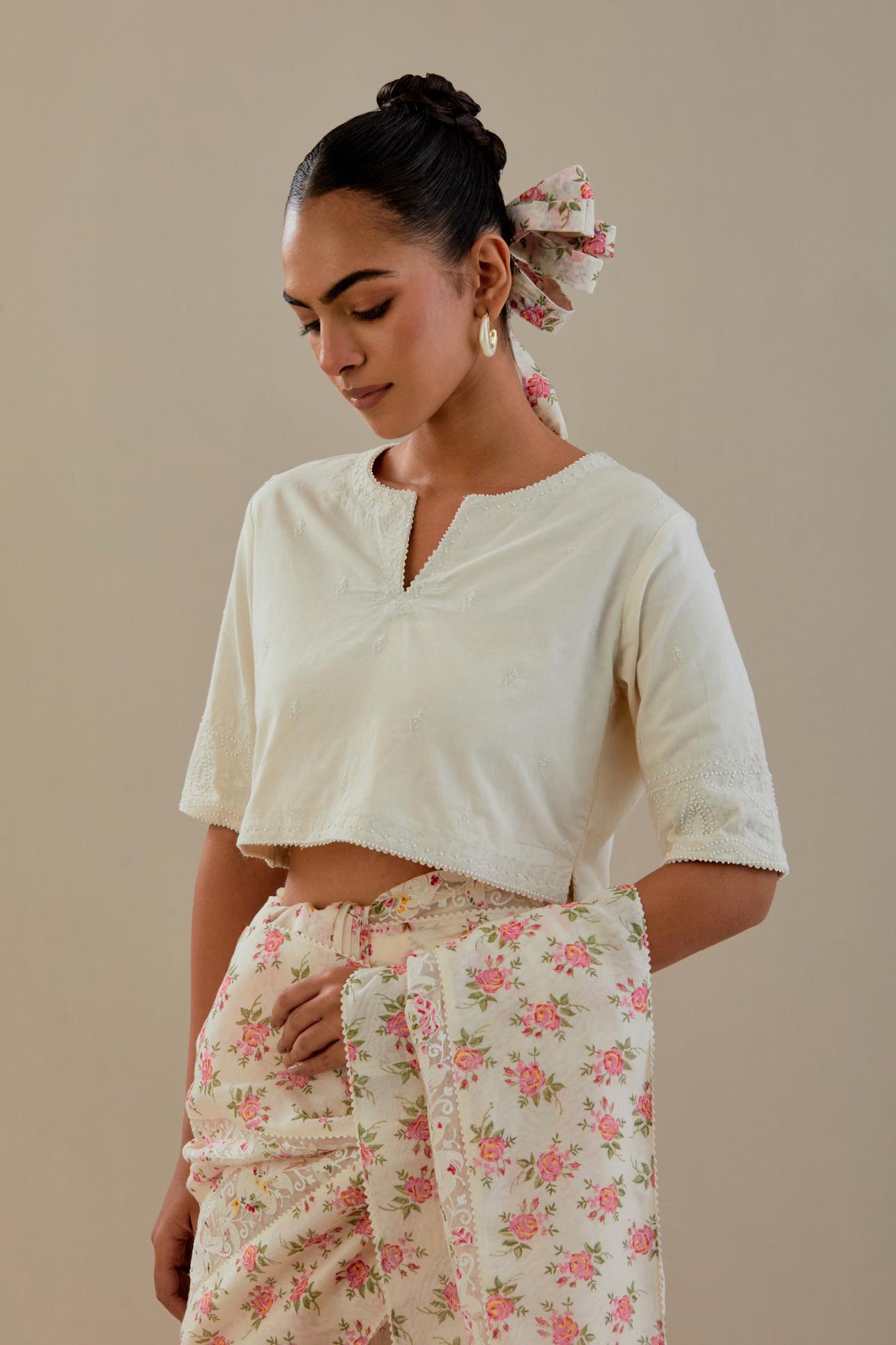 Off-white cotton blouse with thread embroidery & bead work.