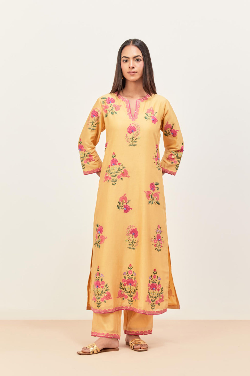Yellow silk chanderi straight kurta set with all-randomly placed appliqued assorted bootas, highlighted with aari threadwork & sequins.