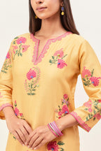 Yellow silk chanderi straight kurta set with all-randomly placed appliqued assorted bootas, highlighted with aari threadwork & sequins.