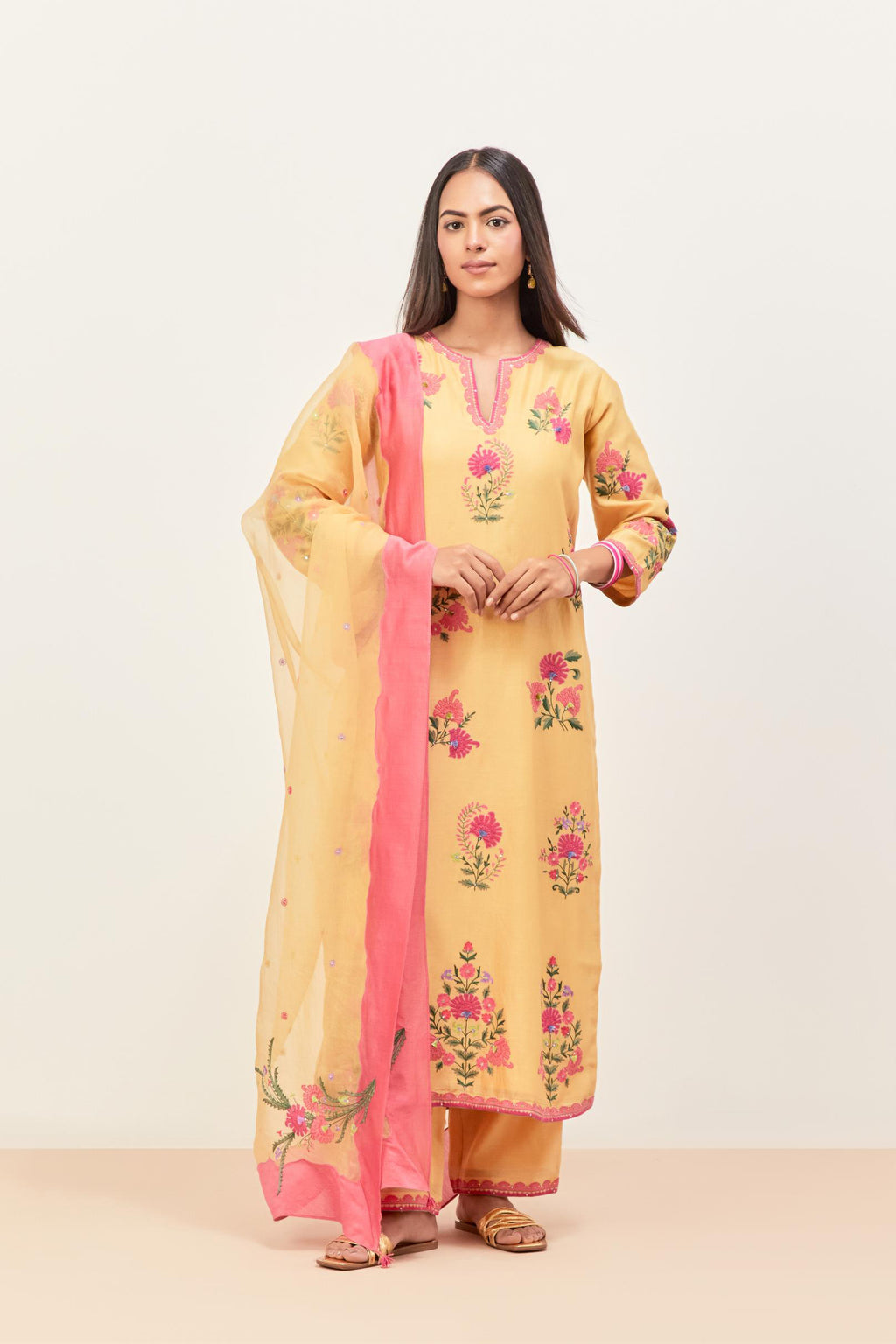 Yellow silk chanderi straight kurta set with all-randomly placed appliqued assorted bootas, highlighted with aari threadwork & sequins.