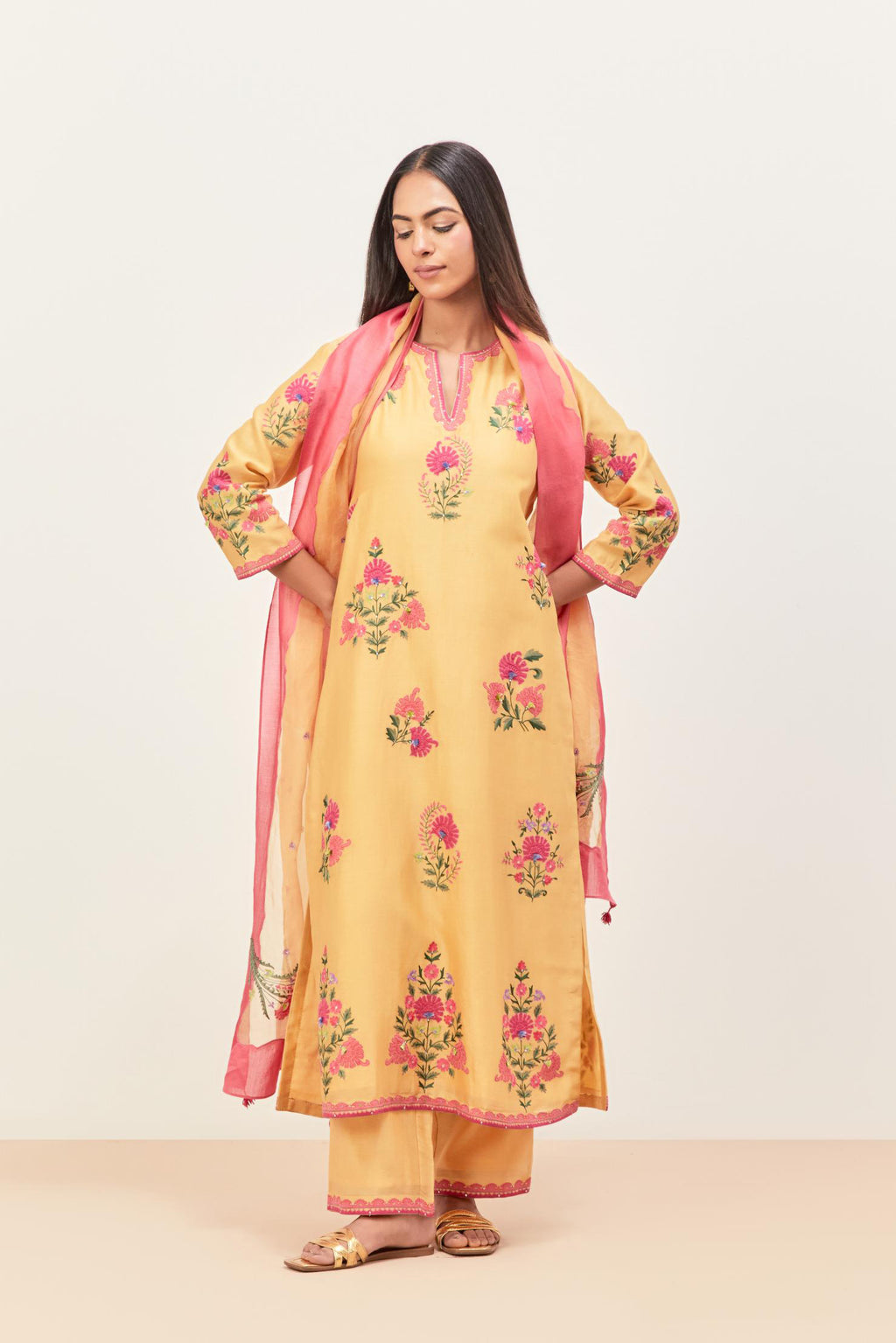 Yellow silk chanderi straight kurta set with all-randomly placed appliqued assorted bootas, highlighted with aari threadwork & sequins.
